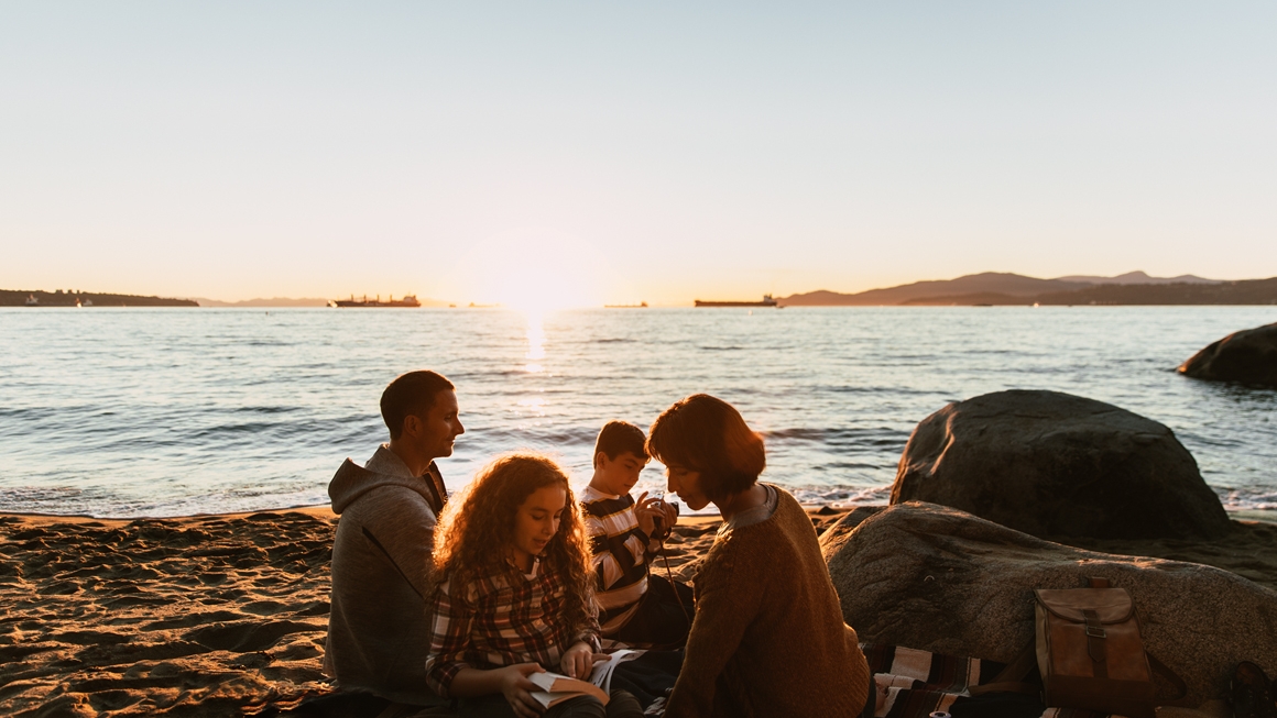 Family picnicking on the beach