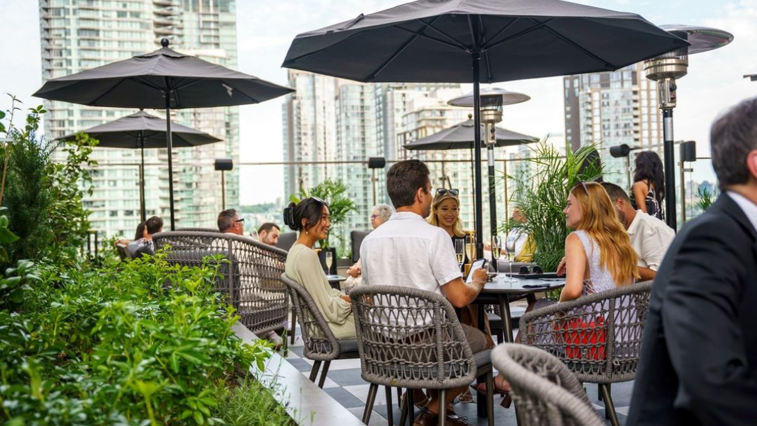 People enjoy the patio at Parker Rooftop in Vancouver